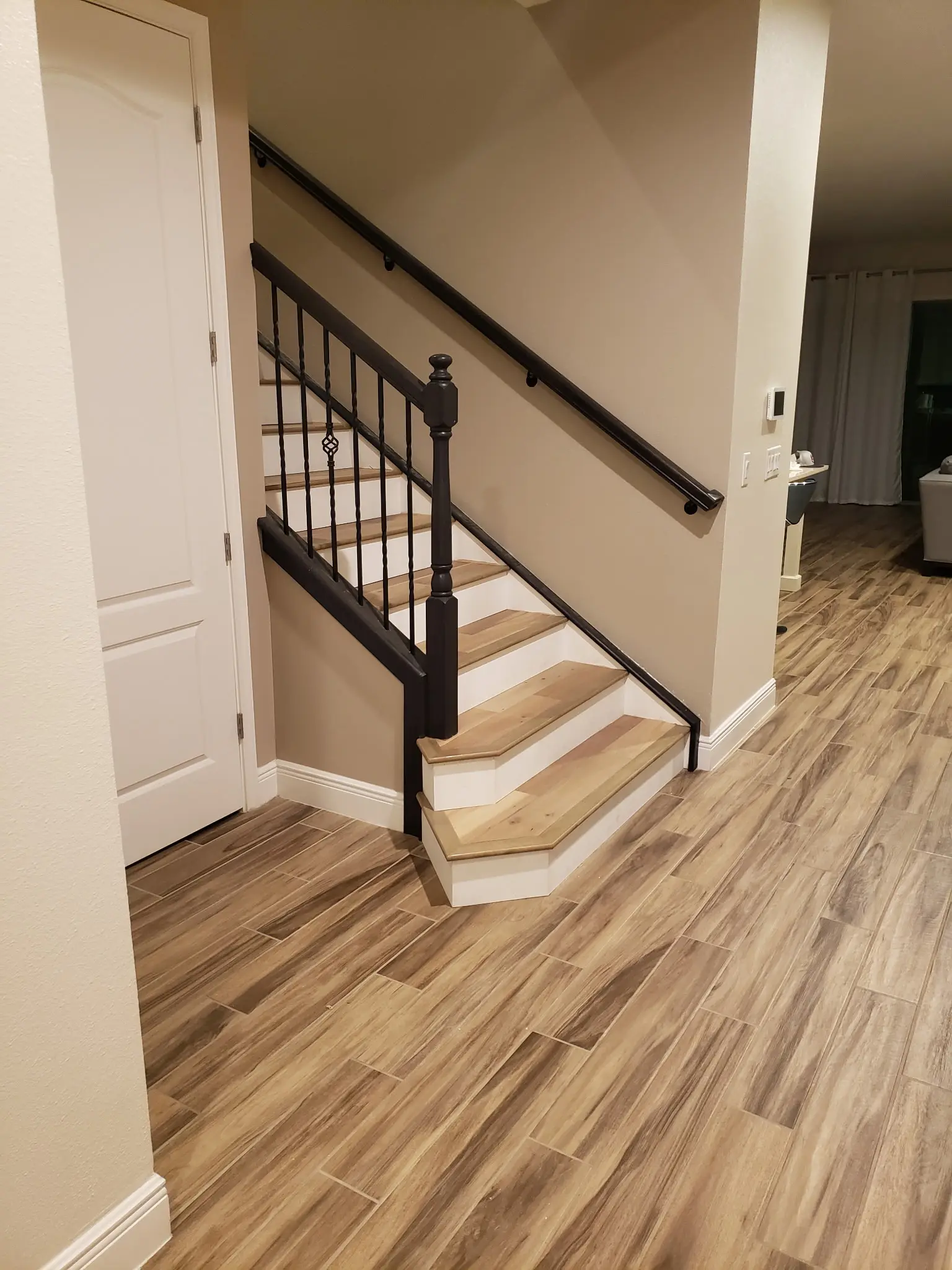 Wood-Look Tile & Stair Update completed by Shullin Boodoo Carpet Inc.